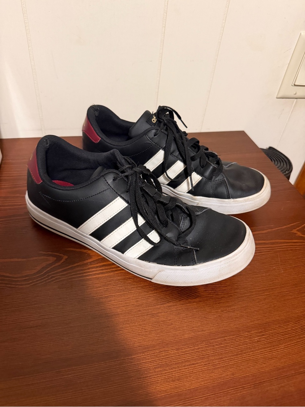 adidas Black Athletic Sneakers with White Stripes and Maroon Heel